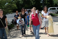 The bride makes her entrance all done up.