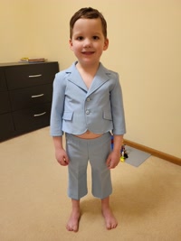 Austin trying on the outfit from my baptism.
